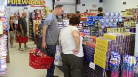 In this file photo, customers fill up on 4th of July fireworks at a store in New England.