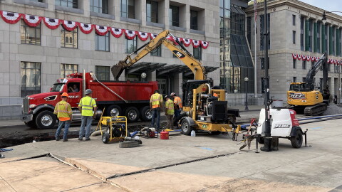 Crews work at the scene of a water main break on North Washington Avenue in downtown Scranton on Monday evening, July 27, 2026.