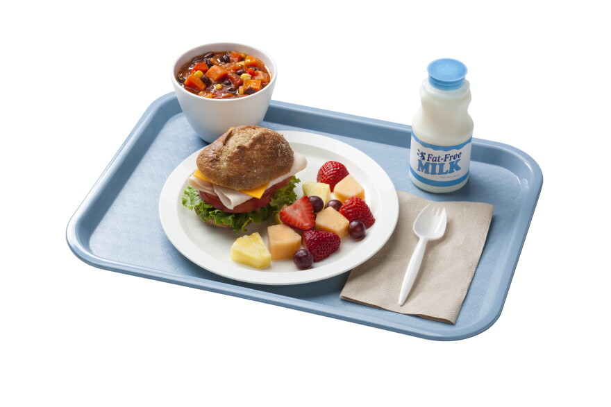 A school tray showing a reimbursable school breakfast for grades Kindergarten through 12. Also shows MyPlate food groups applied to school breakfast.