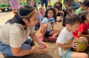 Makawao Head Start Teacher Aide Alyssa Meninzor enjoys a field trip to the Maui Tropical Plantation with the children as they learn about different varieties of fruits and vegetables grown in Hawai’i.