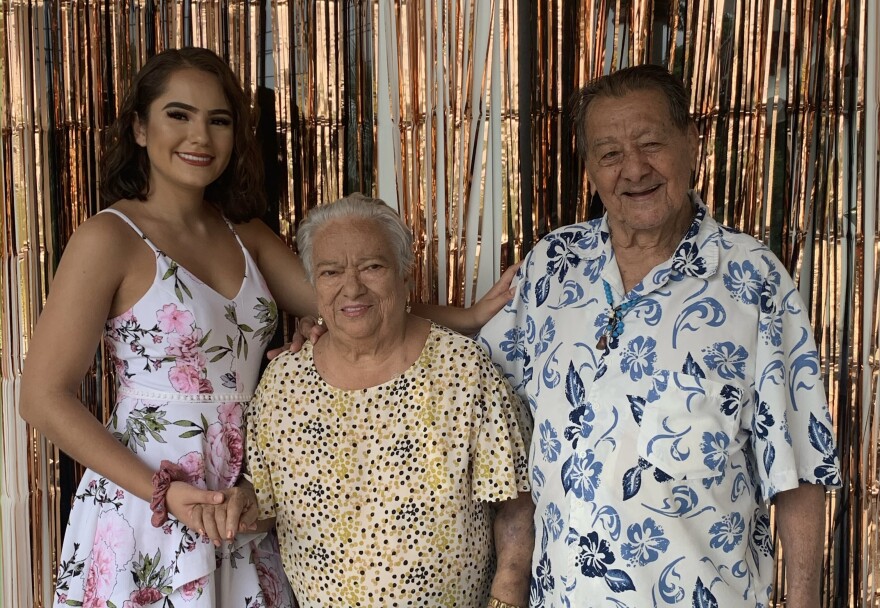 Sarah Rueda with her grandmother, Blanca Valencia, and her grandfather, Marino Valencia at a family gathering in their home on July 18, 2020. Her grandmother passed away six months later after contracting COVID.