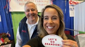  NC GOP finance director Sarah Newby, right, and state chair Michael Whatley display a "Let's go, Brandon" sticker in an image Newby tweeted.