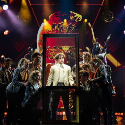 The cast of, "The Who's Tommy" on stage.