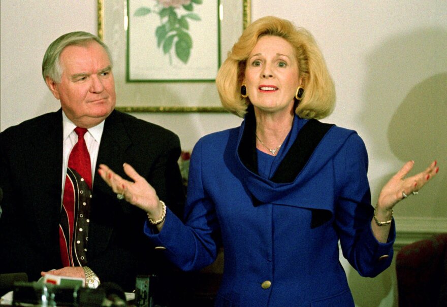 In this March 2, 1995 file photo, Word of Faith Fellowship church leader Jane Whaley talks to members of the media as husband Sam listens during a news conference in Spindale, N.C. Whaley has persuaded a magistrate to issue trespassing charges against Democratic candidate David Wheeler, who brought supporters and a TV crew along to a scheduled meeting at the church. Wheeler says he was invited by Whaley to visit the church, which has been accused of beating congregants to expel demons.