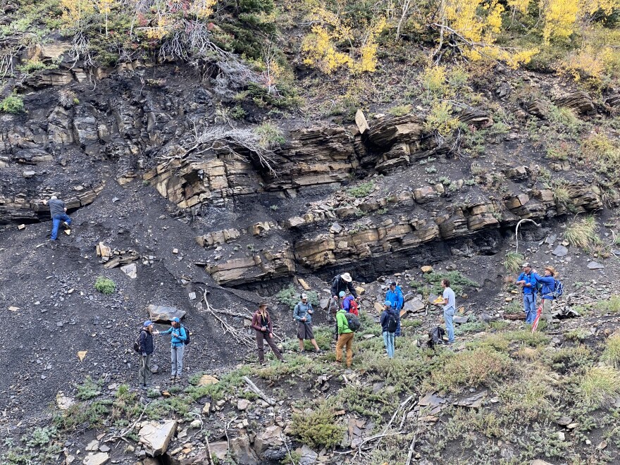 Local stakeholders stand at the base of one of the old coal mines that has been polluting the atmosphere with methane since the last of the mines shutdown in the early 1990s. Caskey estimates the mines are leaking over a million cubic feet of methane every day.