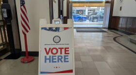 A "Vote Here" sign at an early voting location