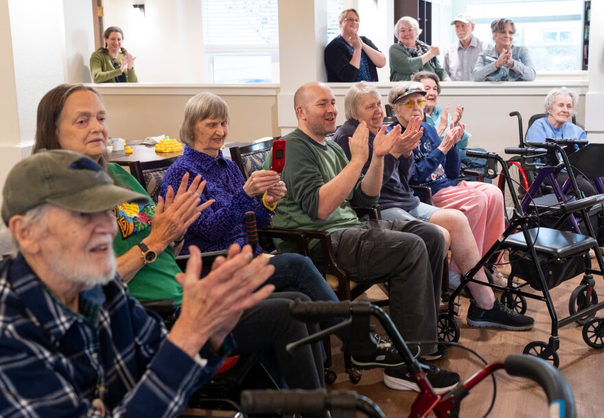 Friends, family and staff celebrate Dillman's 108th birthday on Friday. The facility's staff organized a party, complete with a cake and 108 balloons.