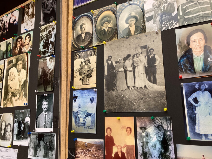Photos of community members lined the entry way into the church, making it possible for visitors to point out their friends and family.