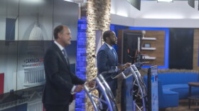 Charles Booker, right, speaks during a debate at the WKYT studios in Lexington, Ky., on Monday, Oct. 19, 2026.