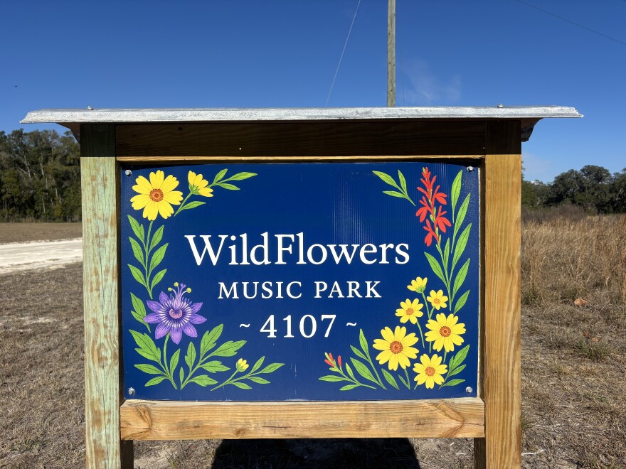 The colorful WildFlowers Music Park sign that greets people as they pull into the property.