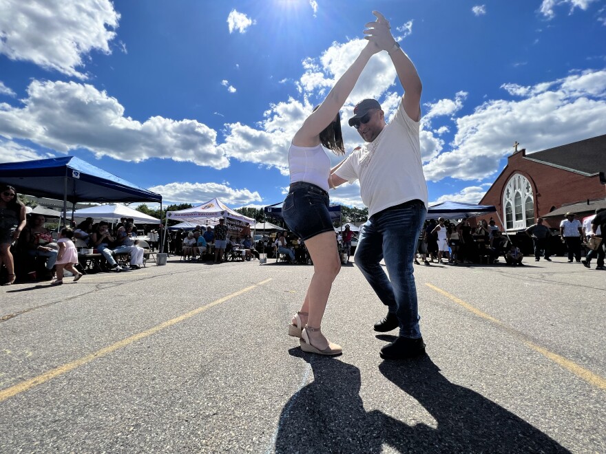 Father Marcos Gonzales dances to the music of Los Arrazadores de la Sierra. 