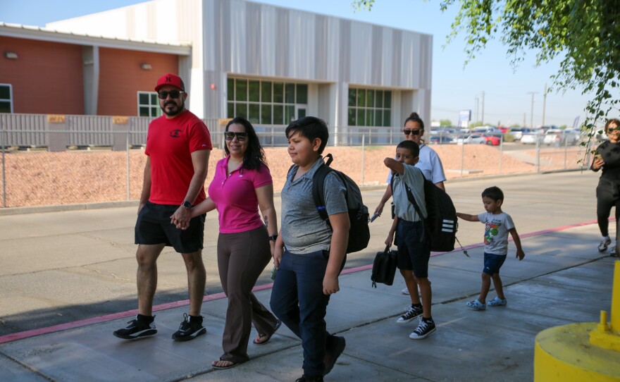 Families held hands as they approached the school.