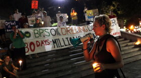 Protesters gathered for a candlelight vigil Thursday in New Orleans to mark the one-month anniversary of the BP oil spill.