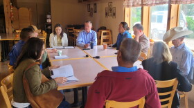 Senator Martin Heinrich sits with members of New Mexico's Agricultural community at Wagner Farm in Corrales on Tuesday.