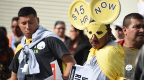 Fast-food workers, health care workers and their supporters shout slogans at a Dec. 4, 2014, rally and march to demand a minimum-wage increase to $15 per hour in Los Angeles.
