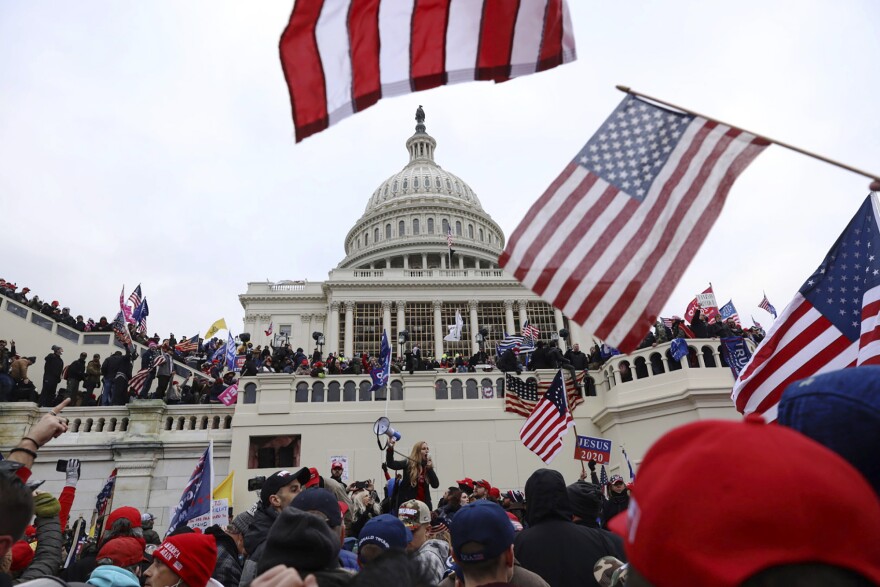 In this Wednesday, Jan. 6, 2021 file photo, supporters of President Donald Trump gather outside the U.S. Capitol in Washington.