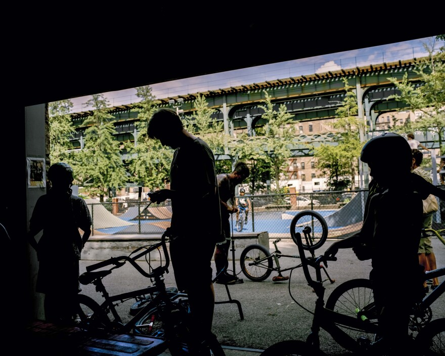 Riders repairing their bikes at the garage, 2016.