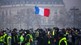 Demonstrators gather near the Arc de Triomphe in Paris during a protest on Saturday.