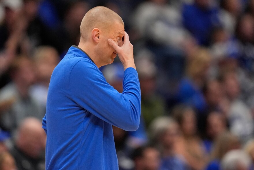 Kentucky head coach Mark Pope wipes his face during the first half of an NCAA college basketball game against Gonzaga, Friday, Dec. 5, 2025, in Nashville, Tenn. (AP Photo/George Walker IV)