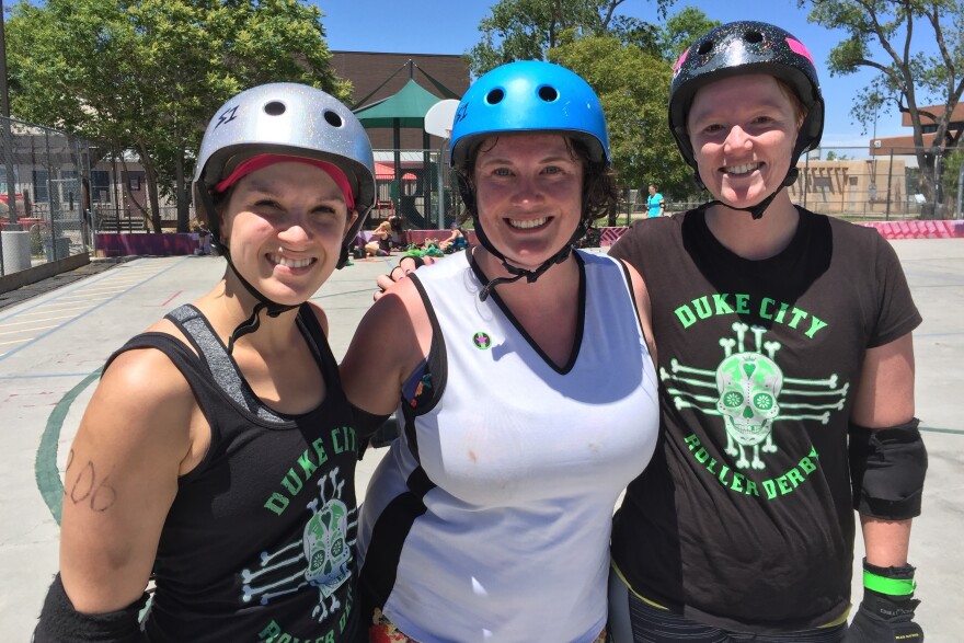 Lauren Winkler, Leigh Featherstone and Holly Chamberlin, left to right, all supporters of Hillary Clinton, at a roller derby scrimmage in Albuquerque, N.M.
