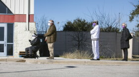 People in Austin wait in line for vaccinations at the Delco Activity Center. Some had appointments, while others did not, and there was confusion about whether those without appointments would be able to get vaccinated.