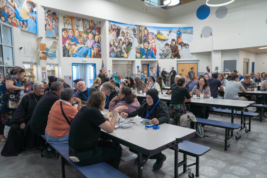 Pilgrims gather for lunch in the main hall of Ke’acik & Aapalluk Memorial School, a pop-up hostel for the glorification services