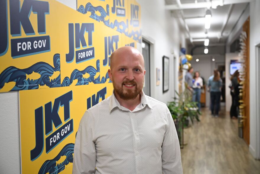 Jonathan Kreiss-Tomkins poses at his primary election night party the The Rail in Anchorage on Aug. 18, 2026.