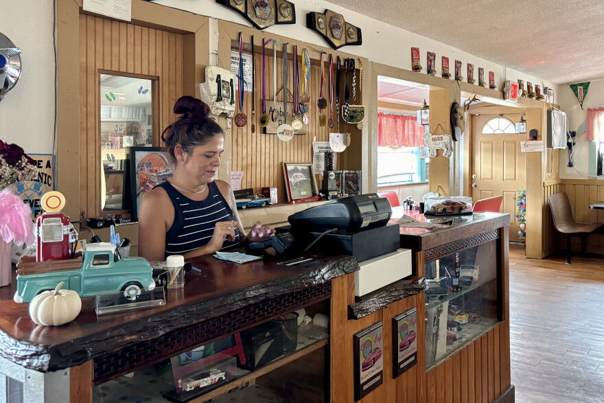 Autumn Tauro rings up a customer at Classic Café in Waldo. Tauro said the cafe relies on its internet-connected payment system to process transactions, making it one of the services most affected when the internet goes out.