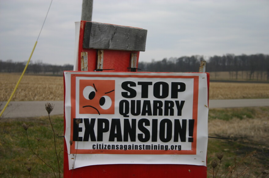 A sign in Mad River Township against the expansion of Enon Sand & Gravel's operation there.