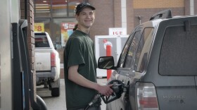 Bryant Fiorenzi pumps gas at a Circle K in Fairbanks on April 12, 2026.