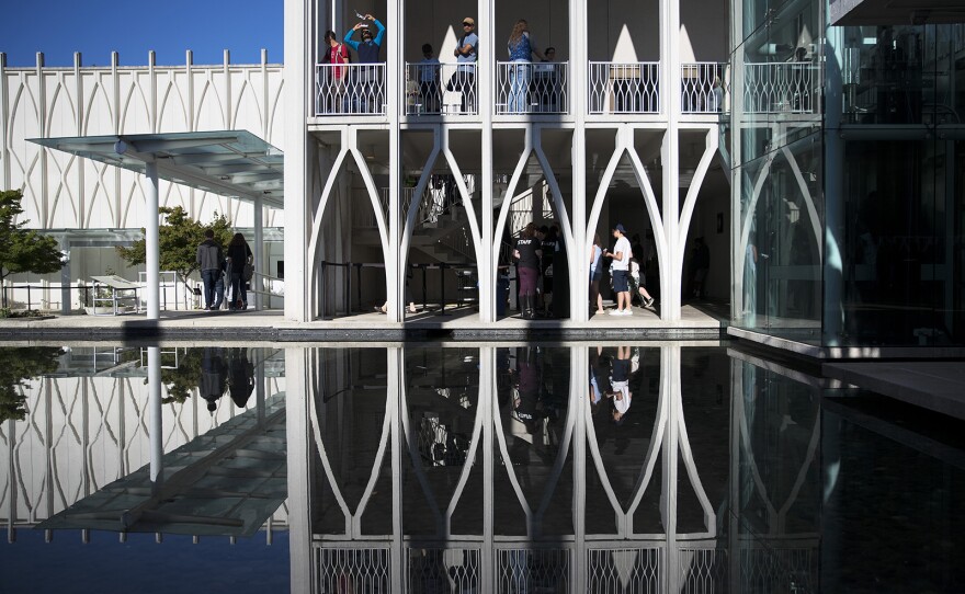 Museum goers test out their eclipse glasses on Monday, August 21, 2017, at the Pacific Science Center before the start of the solar eclipse, in Seattle. KUOW Photo/Megan Farmer