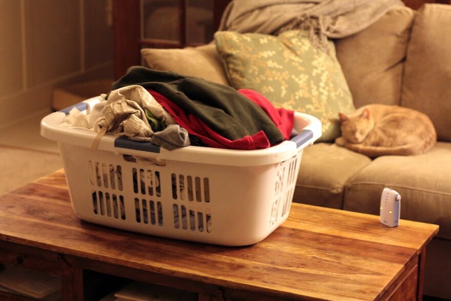 A laundry basket sits on a coffee table.