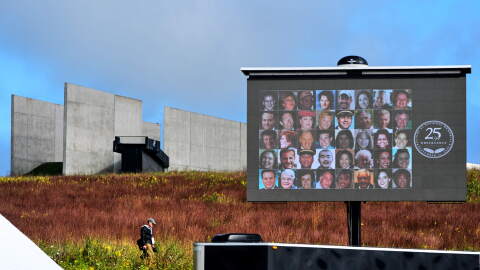 The photos of the 40 passengers and crew killed in the crash of United Flight 93 are shown as their names are read during a remembrance service at the Flight 93 National Memorial in Shanksville, Pa., Friday, Sept.11, 2026, as the nation marks the 25th anniversary of the Sept. 11, 2001, attacks. (AP Photo/Gene J. Puskar)