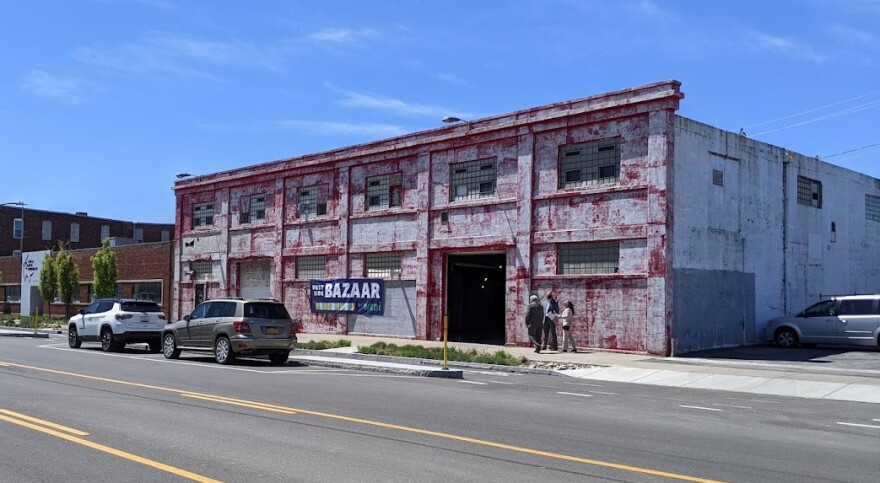 A large building with a banner that says "BAZAAR"