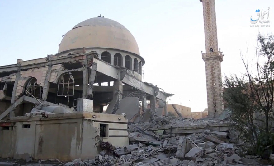 This undated frame grab from video posted online Saturday, June 10, 2017, by the Aamaq News Agency, a media arm of the Islamic State group, shows a mosque that was damaged by bombardment by the U.S.-led coalition and U.S.-backed fighters in the northern Syrian city of Raqqa. (Aamaq News Agency via AP)
