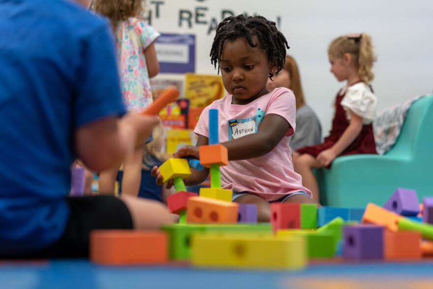 Autumn Baker plays after being dropped off for her first day of pre-K in Affton Tuesday, Aug. 13, 2019.