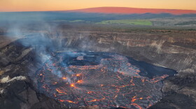 This view from a sunrise overflight at 6:45 a.m. on Friday shows the Kilauea eruption is confined to Halemaʻumaʻu crater in the summit caldera. Mauna Loa (not erupting) is along the horizon in the background.