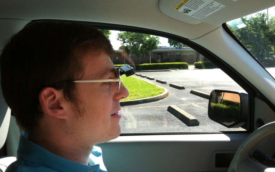 Wearing a bioptic telescope on his glasses, Dustin Jones, who is visually impaired, is able to drive.