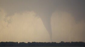 A tornado forms and touches down north of Soloman, Kan., Saturday, April 14, 2012.
