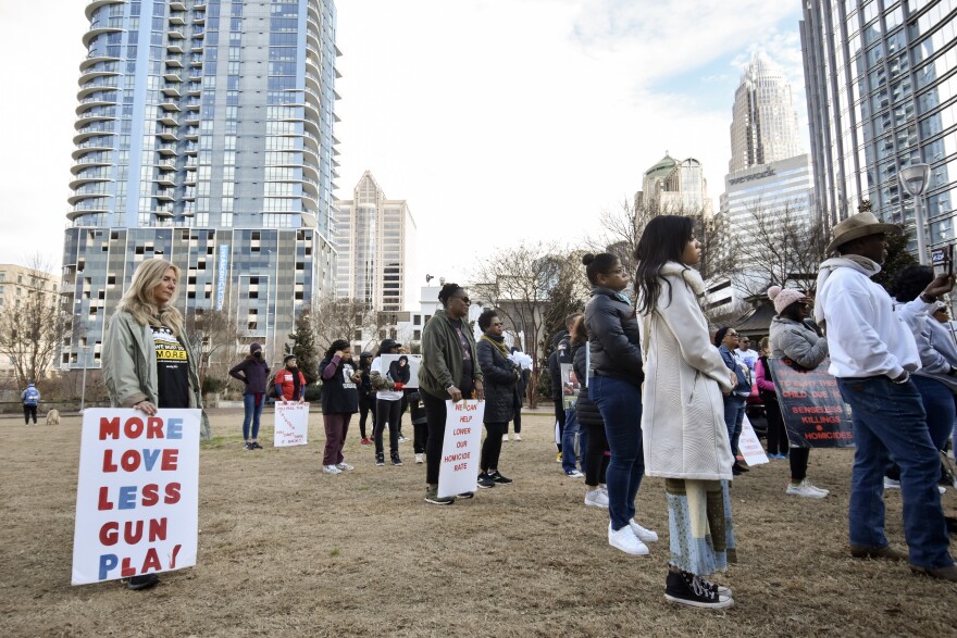 Relatives of people killed by gun violence gathered in Romare Bearden Park on Jan. 7, 2023 following a march through uptown Charlotte.