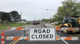 The water has receded, but Edgemere Drive is still closed to through traffic due to debris and flood damage.