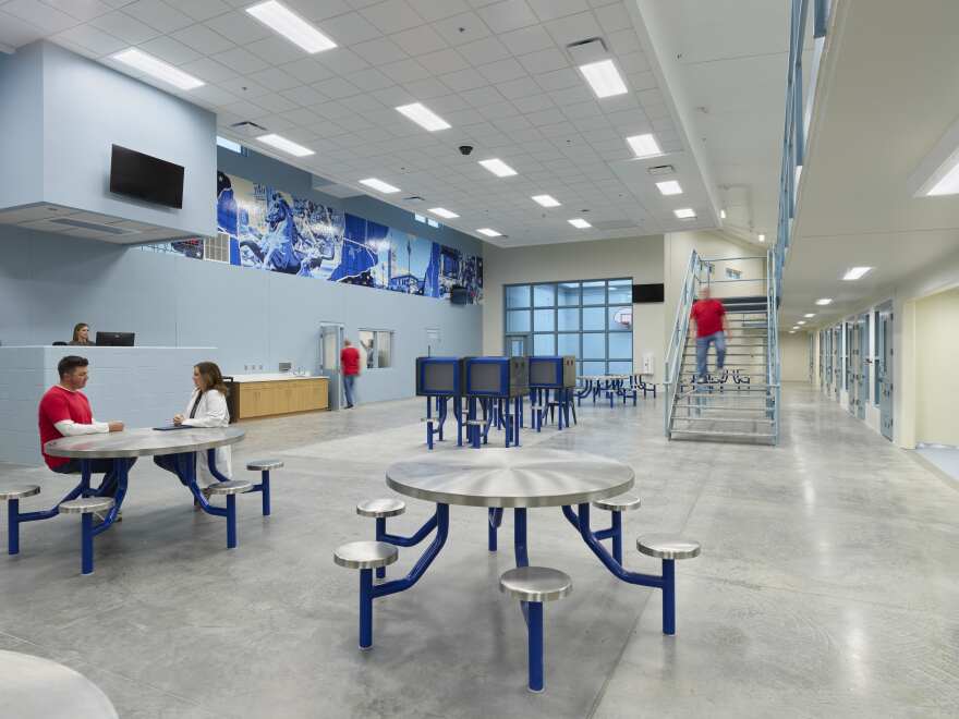 A day room at the new Jackson County Detention Facility has an open air basketball court, game tables, semi-private showers and cells with four beds each.