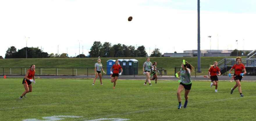 U-High's Melinda Lawrence tries to haul in a pass in a flag football game at Normal Community. (Avery Rawlings/WGLT)