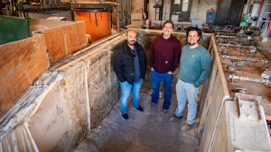Sherif Abdelaziz, left, and Virginia Tech graduate students, pose at the school's research retaining wall. (Photo courtesy of Virginia Tech)