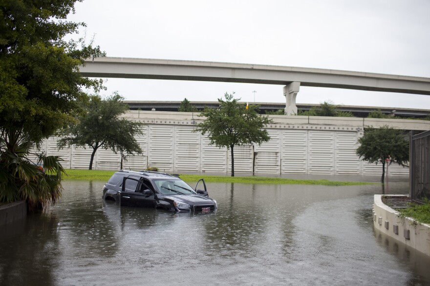 A car is left stranded in Houston on Aug. 27.