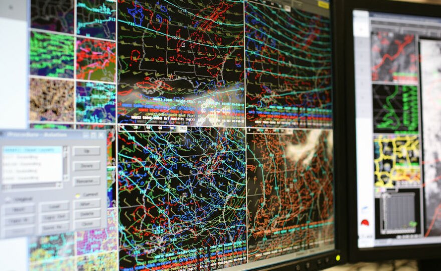 Computer screens at the Birmingham office of the National Weather Service show forecast models. Meteorologists use the information to predict severe weather. During Alabama's tornado outbreak on April 27, 2011, forecasters were forced to take shelter when one of the twisters came close to their offices.