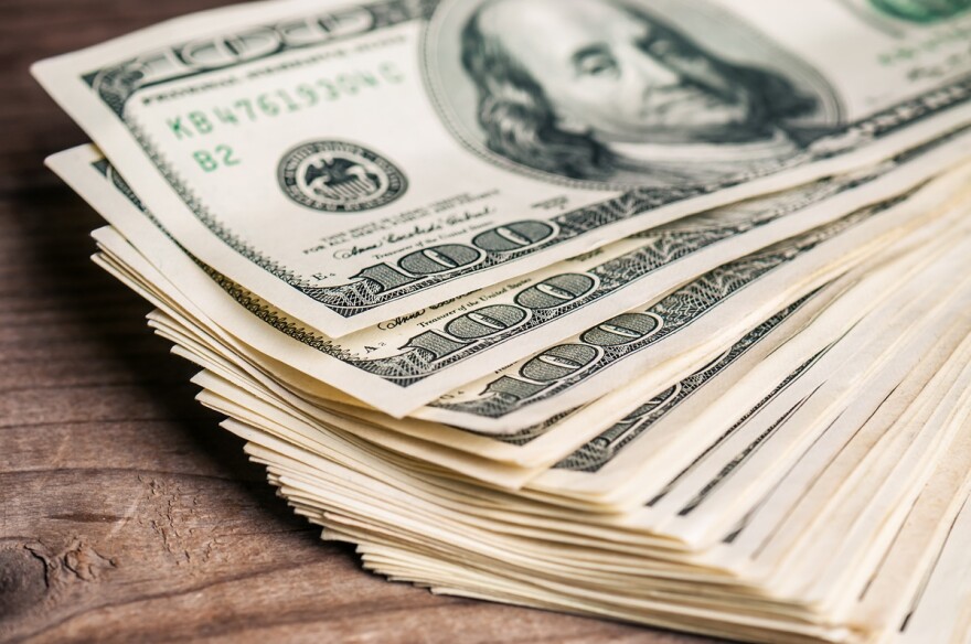 stack of hundred dollar bills