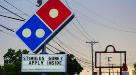 A Domino's Pizza in South Bend tells workers to apply if they're run out of pandemic stimulus money.