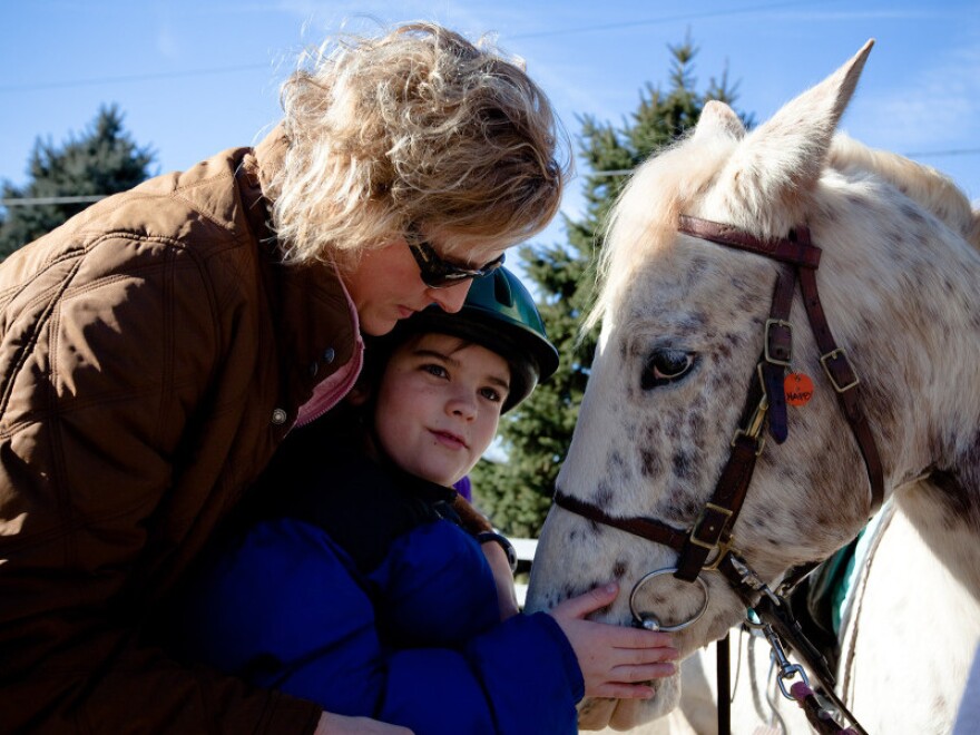 Cathy Coleman is a speech pathologist for the Northern Virginia Therapeutic Riding Program. She uses a horse named Happy in her therapy sessions with 9-year-old Ryan Shank-Rowe, who has autism.