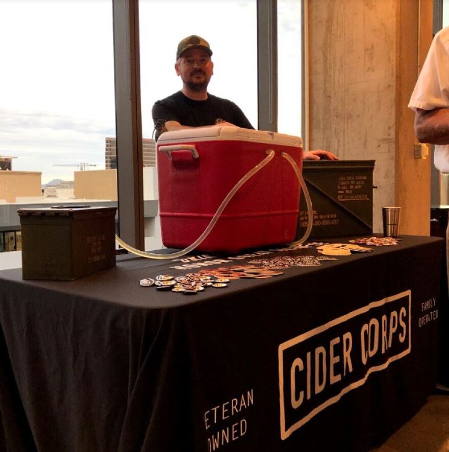 Levi Dodd pours craft cider brewed by veteran-owned Cider Corps, based in Mesa.